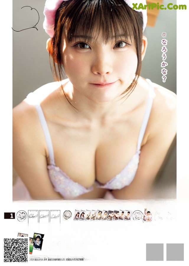 A woman in a white bra and a pink hat.